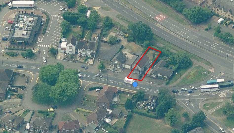 The neighbouring detached property at No. 883 has an attached garage adjacent to the shared boundary. The property also has a vehicular crossover close to the boundary with the application site. No. 887 is a detached bungalow and has an attached garage adjacent to the boundary.