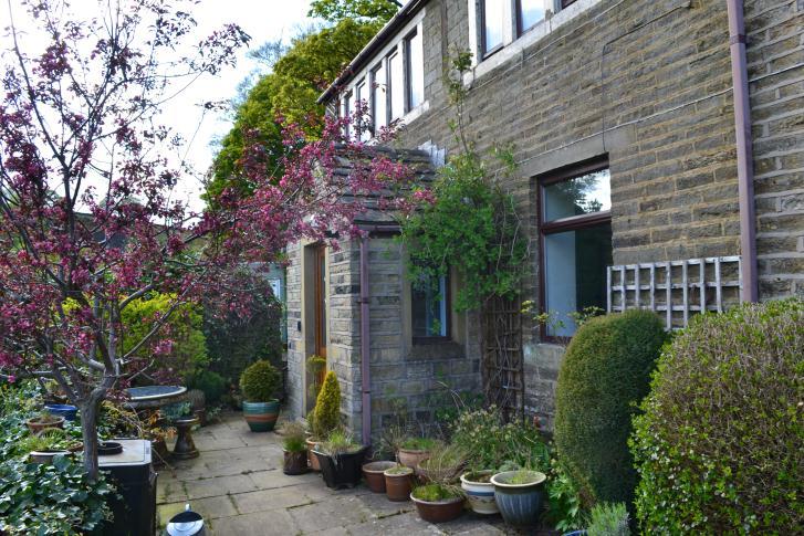 Hart Holes, 53 Greenfield Road, Holmfirth, HD9 3XQ A traditional stone built detached cottage occupying a stunning location with views down the valley, complete with approximately 2.