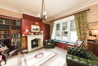 externally The property is approached via a private drive shared with the neighbouring dwellings and sits within secluded, lightly wooded gardens which lie mainly to the front and side of the