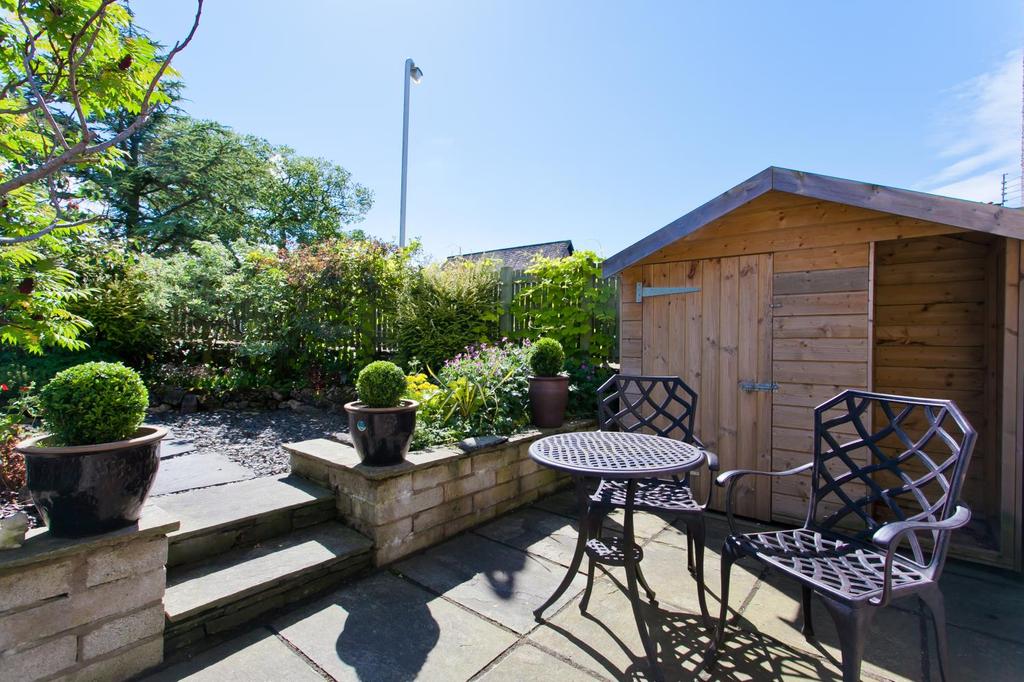 Outside Just off Haggs Lane, Maggie Puddle Cottage benefits from a gravelled parking space with private parking for two cars which is surrounded by a variety of flower beds with mature, low