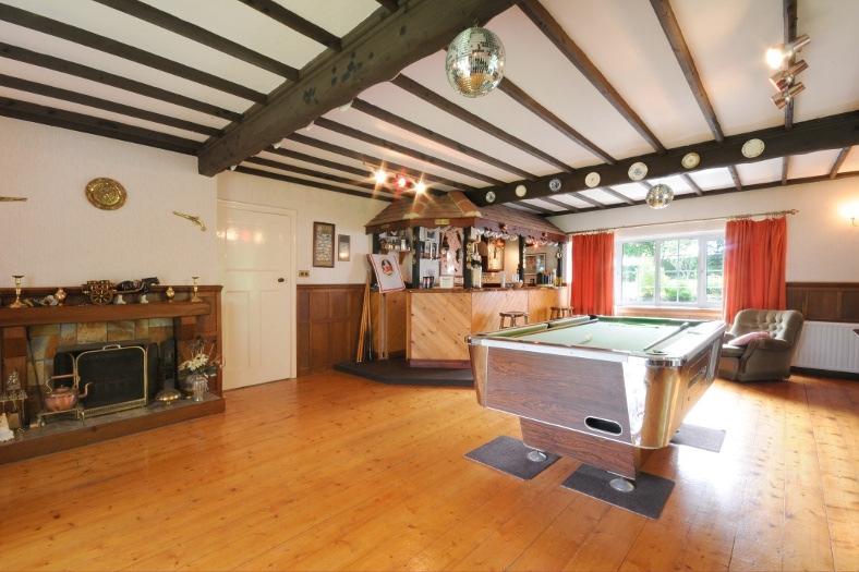 Complete with exposed timber ceiling beams, timber panelled walls and an open fireplace this relaxed room really does have that country pub feel.