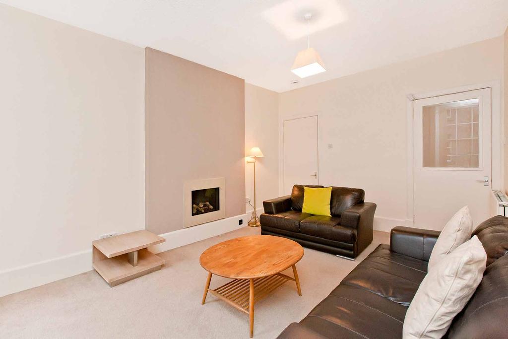 Accessed via a communal stairwell with secure entry, the flat opens into a spacious central reception hall with incorporated storage and large enough to accommodate furniture.