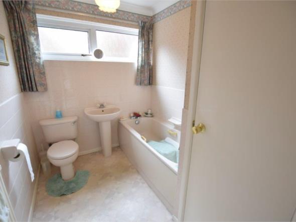freestanding furniture, there is a double glazed window to the rear elevation, radiator and a range of fitted wardrobes with dresser unit BATHROOM 9'0X6'5 (274m X 196m) The bathroom features a three