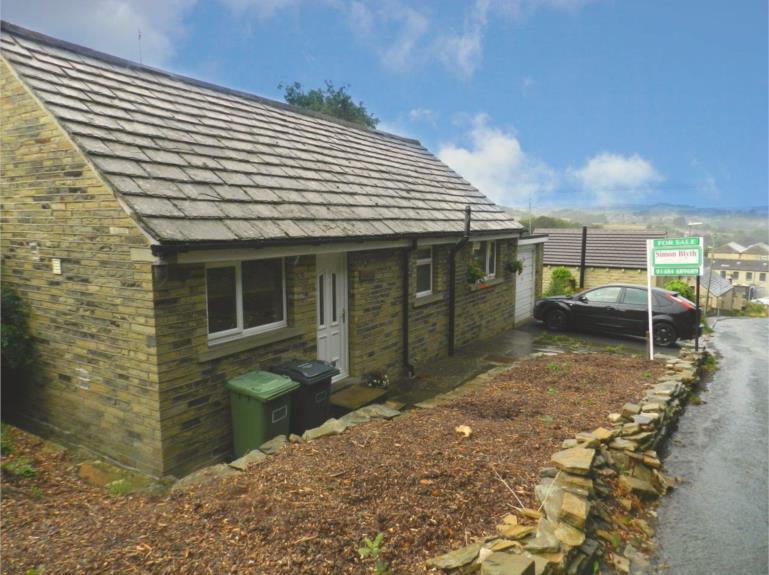 HILCOTE HORN LANE NEW MILL, HOLMFIRTH HD9 7HG Superbly positioned detached bungalow with lower ground floor space, garage, very large driveway, huge amount of potential and simply amazing views