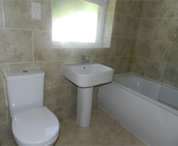 pleasant outlook towards Horn Lane and a loft access point BATHROOM The property's bathroom is fitted with a three piece stylish suite in white It comprises of low level WC, pedestal wash hand basin