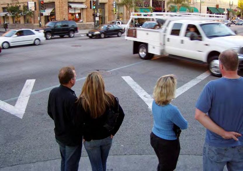 Pedestrians pay a price in delay: Pedestrians wait for traffic in one direction Pasadena