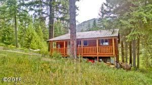 3 bedroom 2 bath home with a 2 bedroom guest cabin that has also served as an art studio and is currently a rental. Open, bright living area with reservoir views and access, large master bedroom.