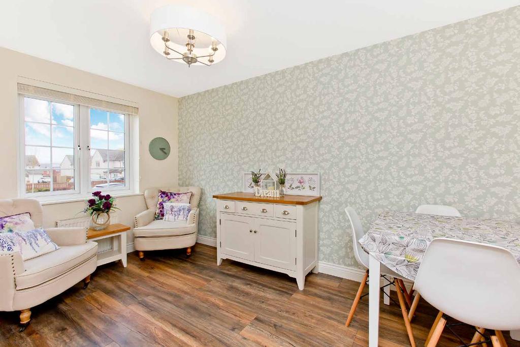 Set behind a neat lawned garden with a charming stone-mullioned frontage, the house opens into an airy hall incorporating useful storage and laid with rich wood effect flooring which flows through
