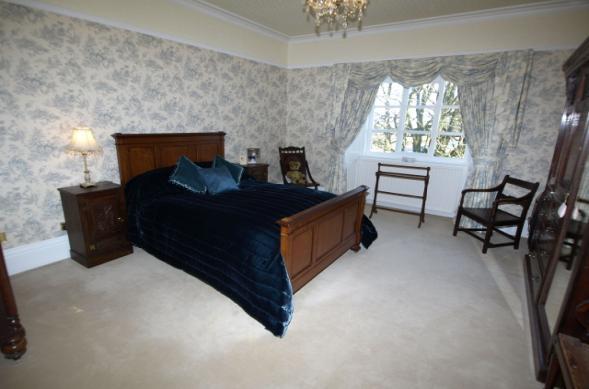 FIRST FLOOR BEDROOM ONE 15' 9" x 13' 9" (4.8m x 4.19m) A principal bedroom of excellent proportions, front facing windows providing a fine outlook over the formal gardens and extensive driveway areas.