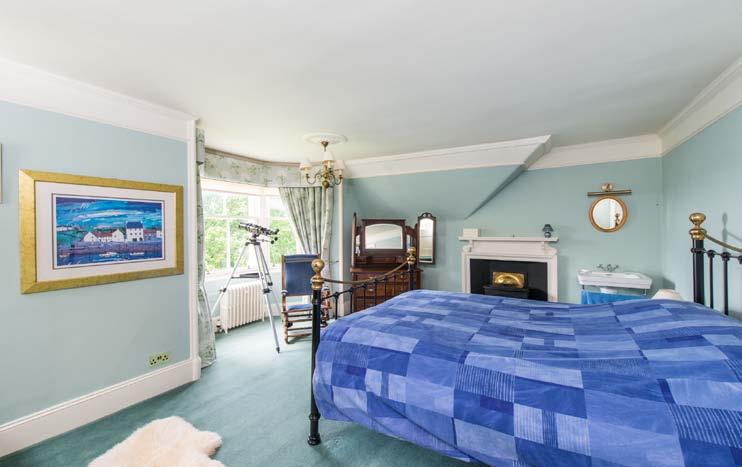 At first floor level the master bedroom is bright and spacious with an attractive raised sitting area within the corner turret, fitted wardrobes and a traditional press with safe.