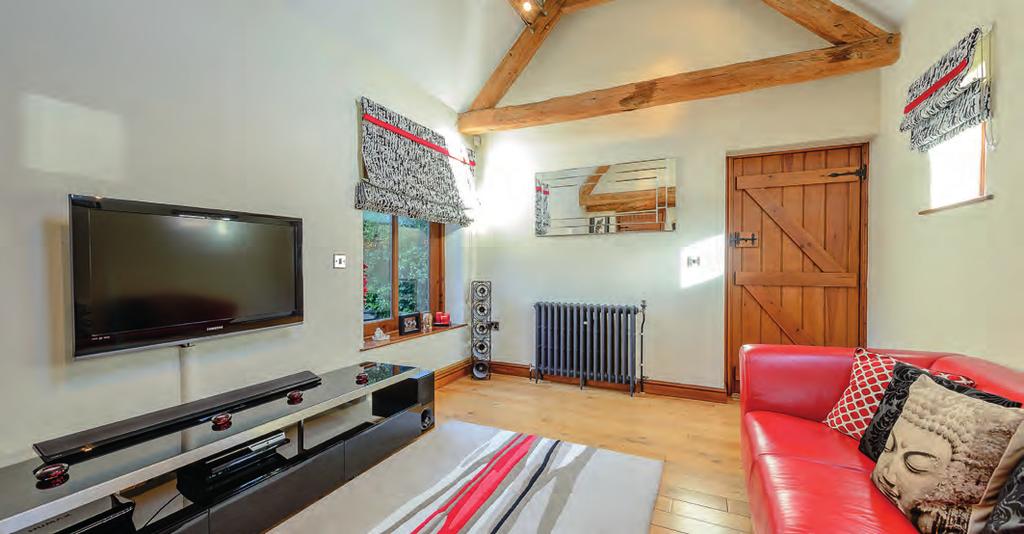 Accommodation Summary Ground Floor The entrance hall has a vaulted ceiling with exposed ceiling beams, a conservation style Velux roof window, Victorian cast iron radiator and a flagstone floor that