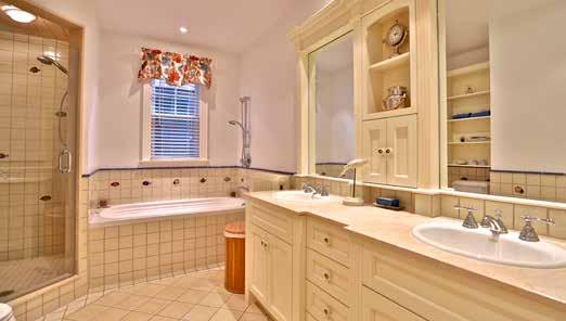 Heated tile floor Custom vanity with two sinks Separate shower