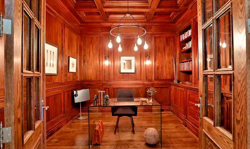 door entry Custom wainscoting Coffered ceiling Chandelier Custom built-in shelving and cabinetry Wall