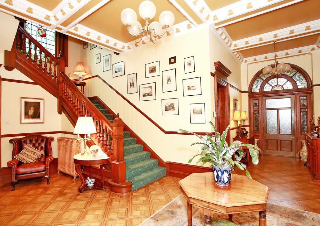 with timber surround, tiled inset and hearth and baxi fire grate with over-mantle mirror; high ceiling with ornate plasterwork, cornice and picture rail; original wooden flooring.