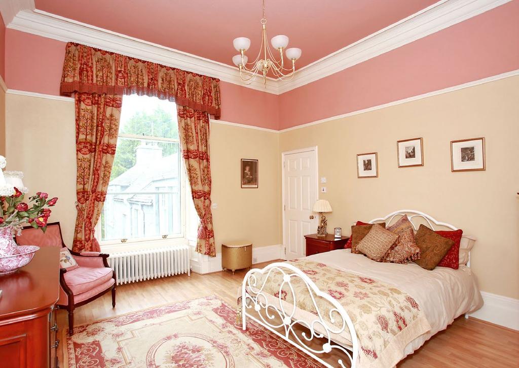 Window to the side. BEDROOM (16 5 x 16 5 ) Large double bedroom with sash and case window overlooking the rear garden. High ceiling with cornice and picture rail; fitted carpet.