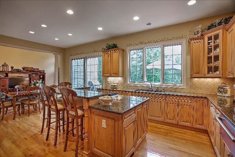 You will love the multi-tiered center island, with separate work surface, breakfast bar, and cooktop, designed to a multitude of purposes, at different levels and angles.