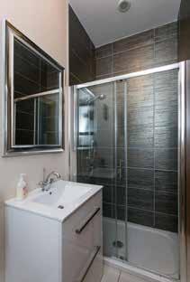 Leading to: ENSUITE SHOWER ROOM: Power shower with thermostatic controls.