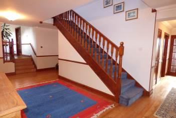 Entrance Hall A spacious and welcoming with solid wood flooring containing the staircase to the