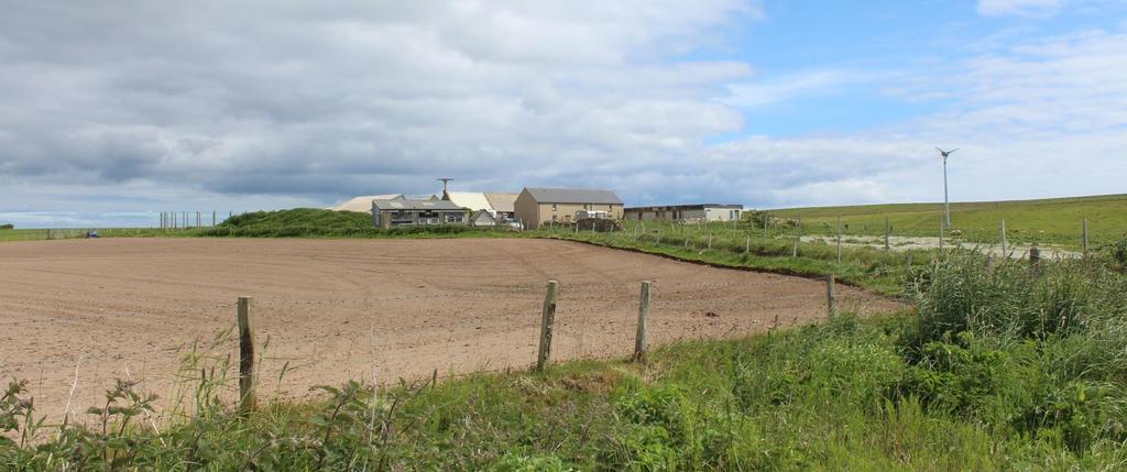 includes an attractive three bedroom farmhouse, stables, a range of outbuildings and a