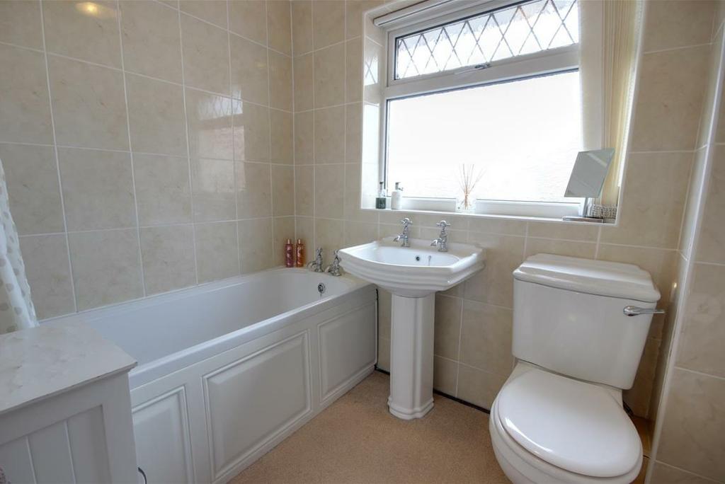 BATHROOM With suite comprising bath with shower over, pedestal