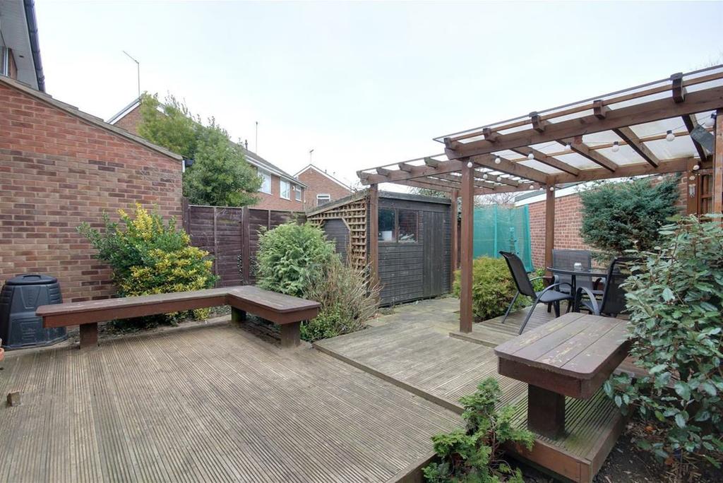 The rear garden is ideally set out for entertaining with decked