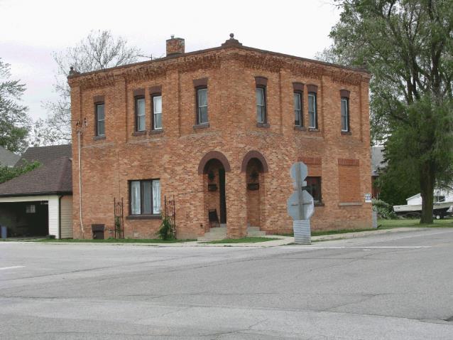 Architectural Significance/Description: This two storey brick building has two very unique architectural features. The arched corner entrance and indented brick work along the cornice.