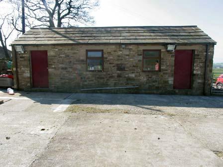 a stone barbecue and pizza oven. Further down the garden there is a large hard standing area with an outbuilding that used to be used as two stables and can easily be changed back to that.