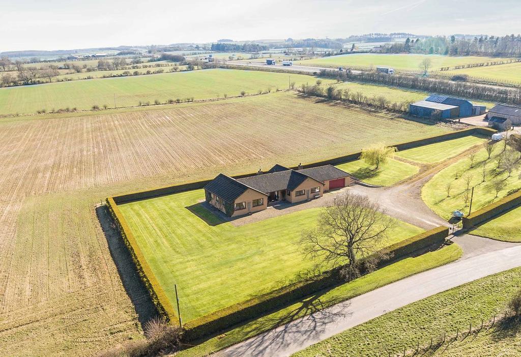 A substantial bungalow and farm steading