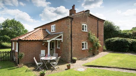The cottage has an enclosed garden, with paved seating area with additional access through a gate to a private stretch of riverbank alongside the meandering River Bure, the perfect place for a spot
