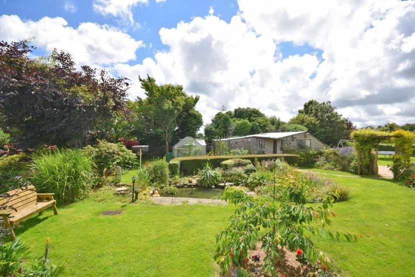 country home within mature gardens and grounds of