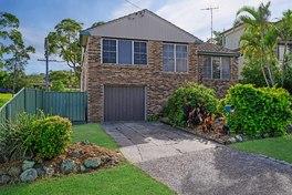 4 2 1 Price: $595,000 BELMONT NORTH, 26 Mirambeena Street COMMANDING BRICK & TILE HOME Four Bedroom, two bathroom brick and tile home in one of Lake Macquarie's high growth suburbs.