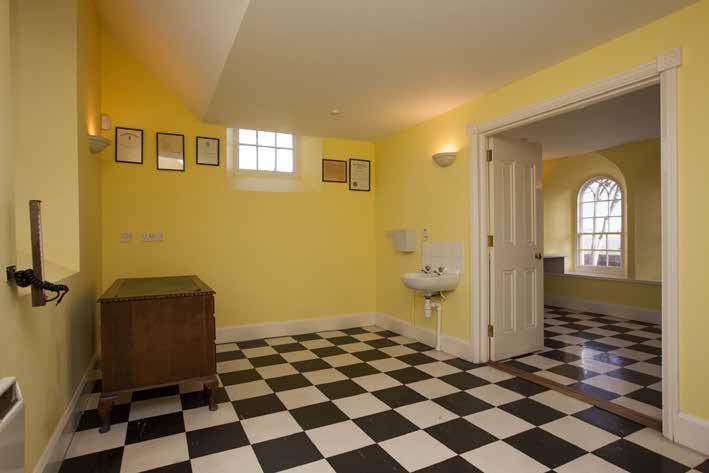 ROOM (1): 15 0 x 9 7 (4.57m x 2.92m) Arched window. Built-in storage cupboard. Pedestal wash hand basin. Black and white tiled floor.