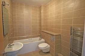 9m plus shower Power shower, bath, WC & vanity unit. Kitchen/Dining Room 7.8 m x 4.1 m Outstanding room with large, glazed views west and overlooking the plaza below.