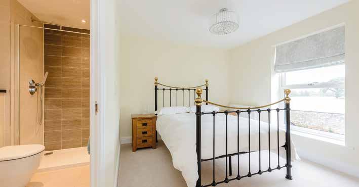 The master bedroom enjoys views beyond the walled gardens over neighbouring farmland via a rear window, there is a large dressing room with window to the rear and another oak door that leads to the