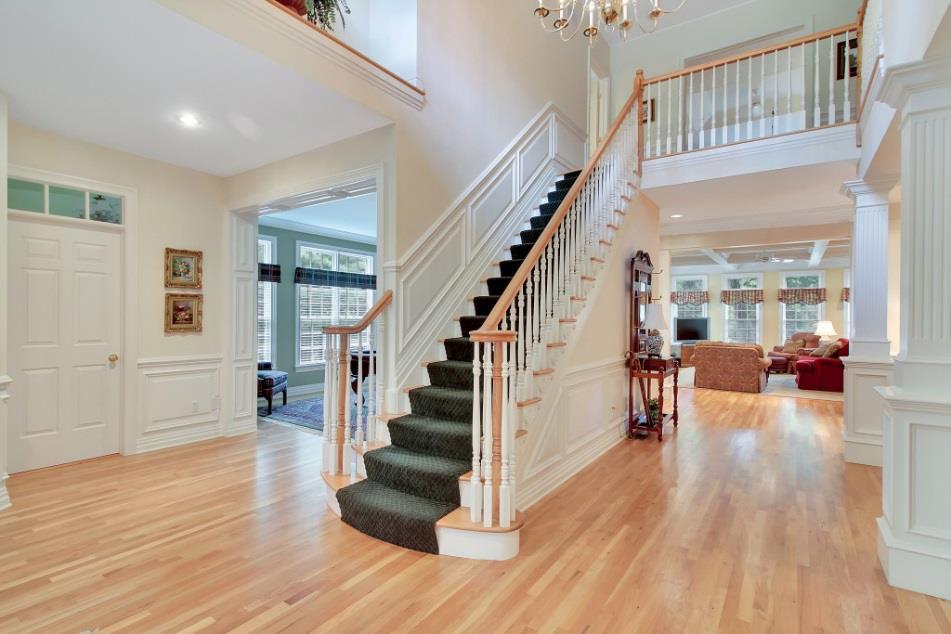 Foyer: From the moment you enter this gracious home, a two-story oak staircase greets you with an air of sophistication that continues throughout.