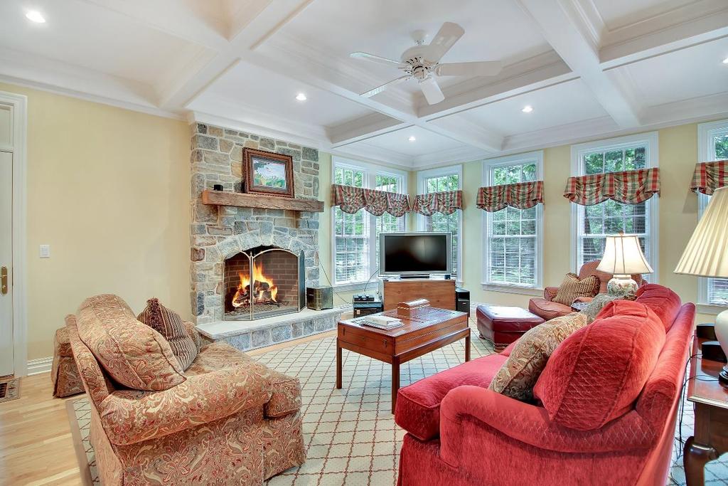 This fabulous room delivers style and function with coffered ceilings, striking millwork,
