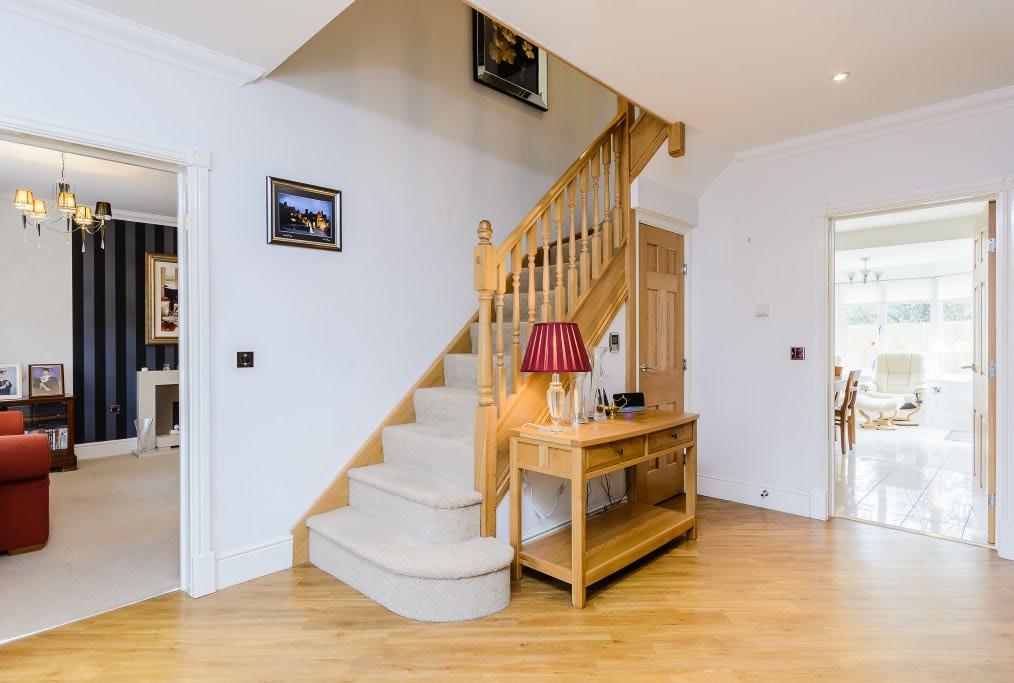 The reception rooms lead off the hallway and a staircase with Oak balustrade rises to the first floor.