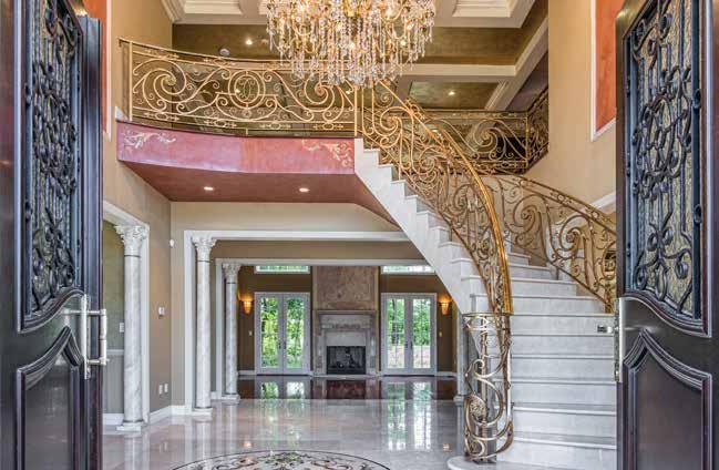 handles from Dubai, private elevator, radiant heat floors in every room and other distinctive features that are too many to mention, this home is unlike any