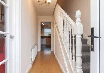 area and breakfast bar Lounge with feature fireplace and solid wooden floor Only a short stroll from Holywood High Street SUMMARY Ideally located off Spencer Street in Holywood, this beautifully
