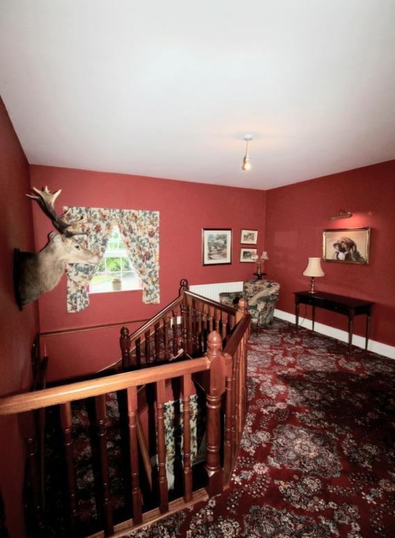First Floor: Gallery Landing: with sweeping mahogany staircase leading to open