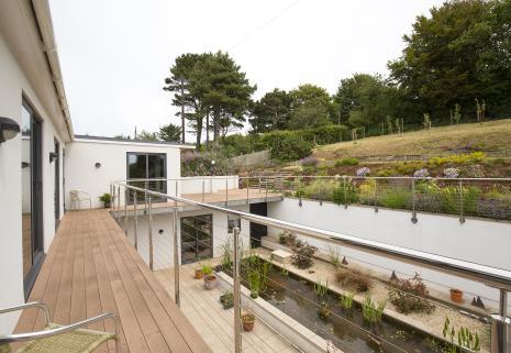 The owners intention of merging the outside in, fitted numerous doors where needed, and includes both bi- folding and patio doors; boasting easy access to its many terraces