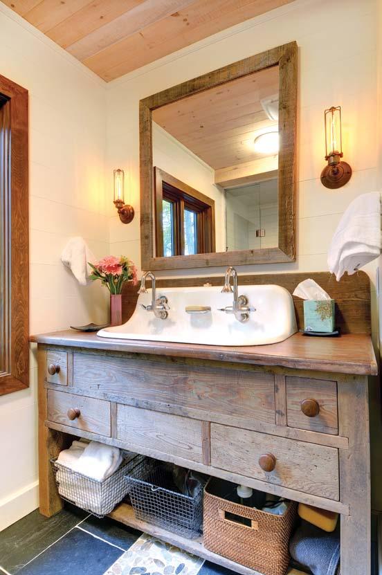 RIGHT: Kohler faucets and Edison light bulbs complement the rustic bathroom vanity.