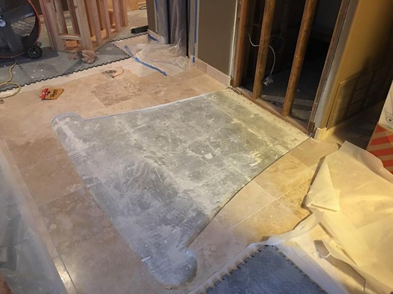 The Travertine tile cut-out, and removed, where the new stairs