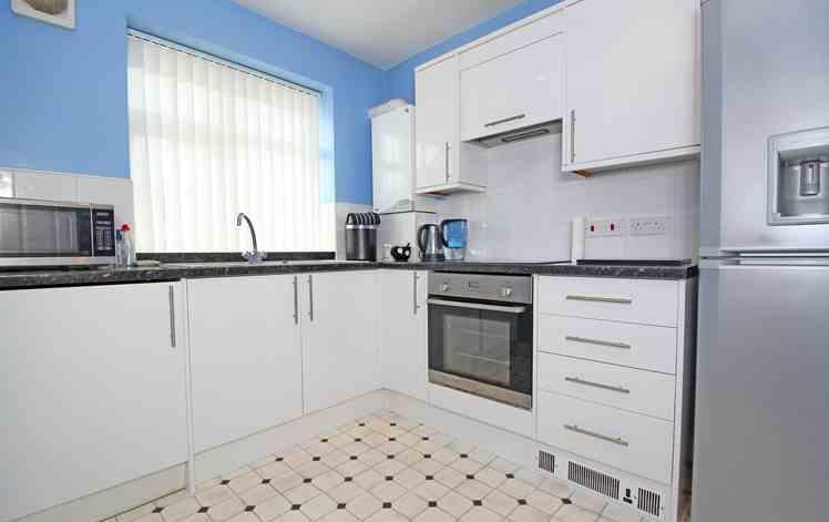 A well presented fitted kitchen with a range of matching wall & base units with worktop surfaces. Electric oven & hob. Integrated washing machine. Stainless steel sink and drainer. Boiler.