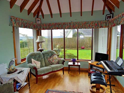Sitting Room With open fire, double aspect windows affording the same