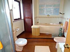 Family Bathroom With bath, WC, WHB, corner shower cubicle, airing cupboard, heated towel rail.