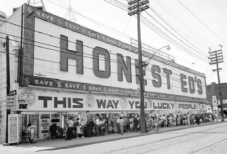 "Honest Ed" Mirvish opened his discount store in the former houses at the southeast corner of