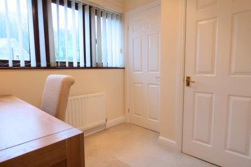 From the hallway a wood panel door opens into the OFFICE ample storage space via the wall length mirrored cupboards to one wall.