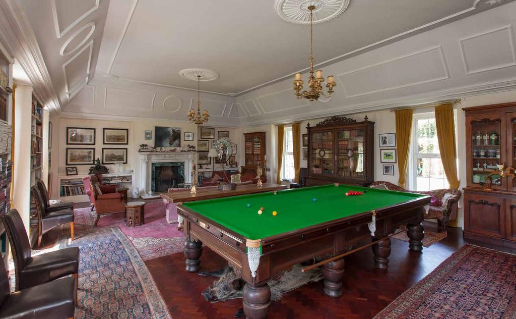 LIBRARY/BILLIARD ROOM: 37' 0" x 26' 9" (11.28m x 8.15m) Solid wood parquet flooring. Ornate ceiling detailing. Twin ceiling roses. Cornice ceiling.