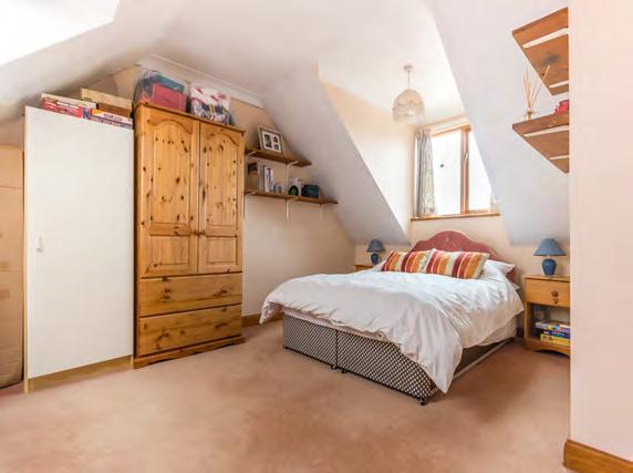 Off the entrance hall, opposite the kitchen, is a utility room with stainless steel sink unit with mixer tap, storage cupboards, space for appliances, such as fridge/freezer and washing machine, a